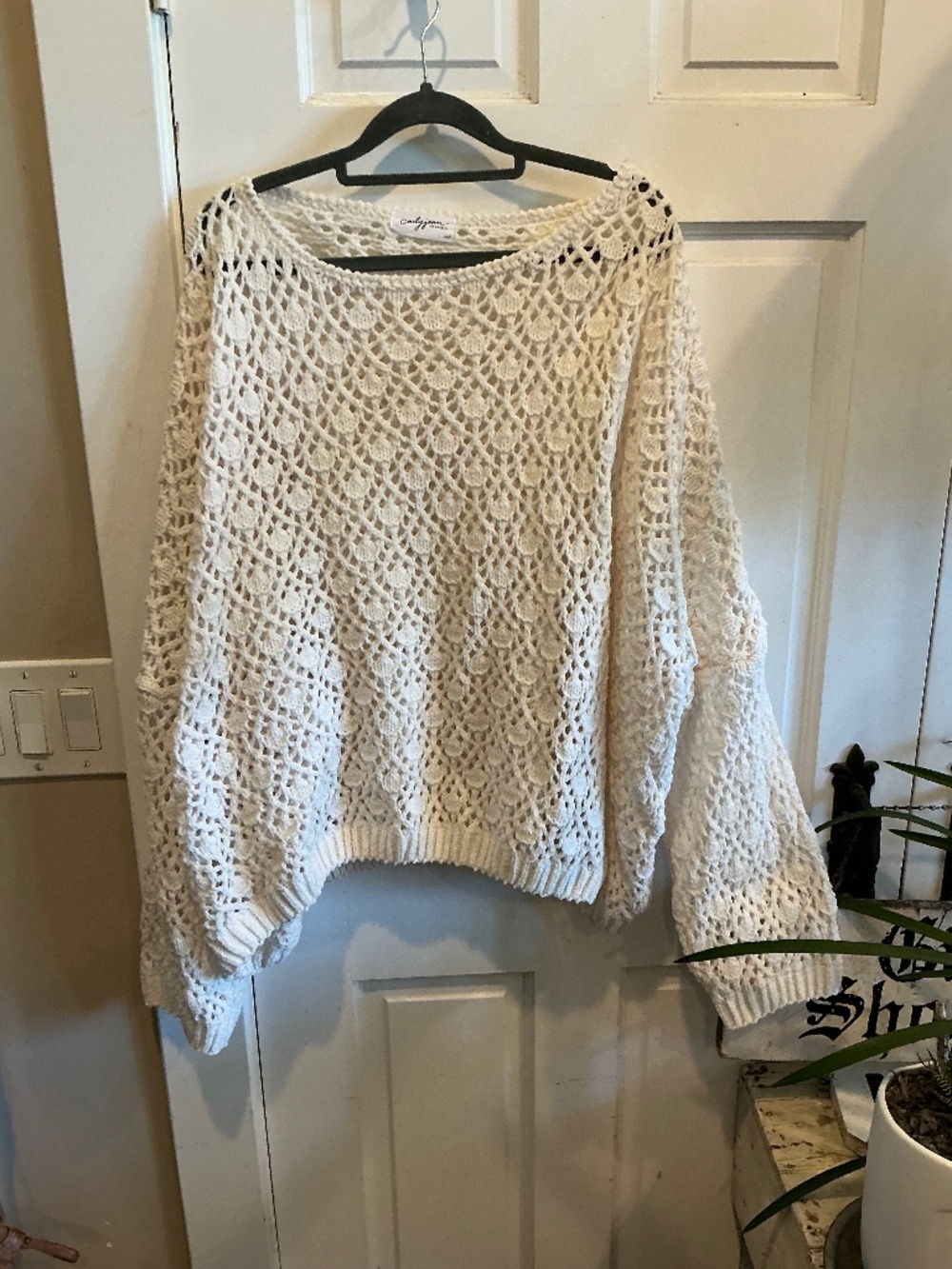Carly Jean pullover sweater in creamy white. Size medium/large